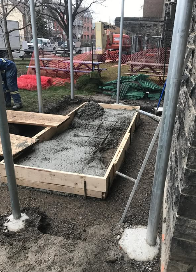 Reinforced concrete placement within timber formwork
