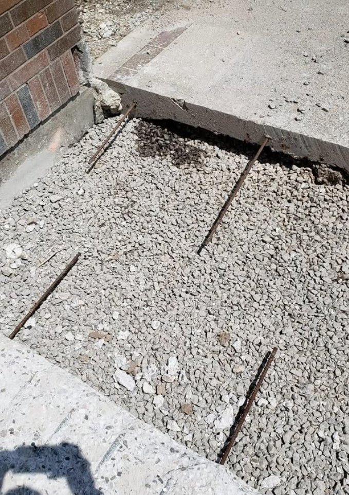 Concrete reconstruction area with dowels and prepared granular base