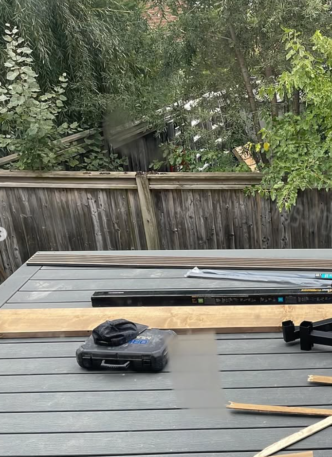 Composite deck boards during installation on a residential deck