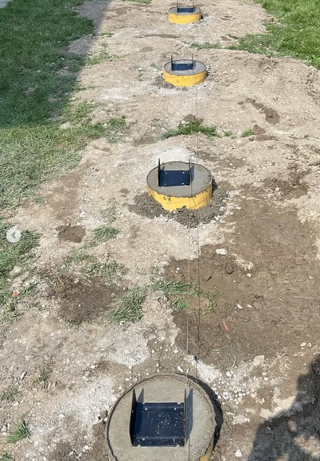 Concrete deck piers fitted with metal post bases